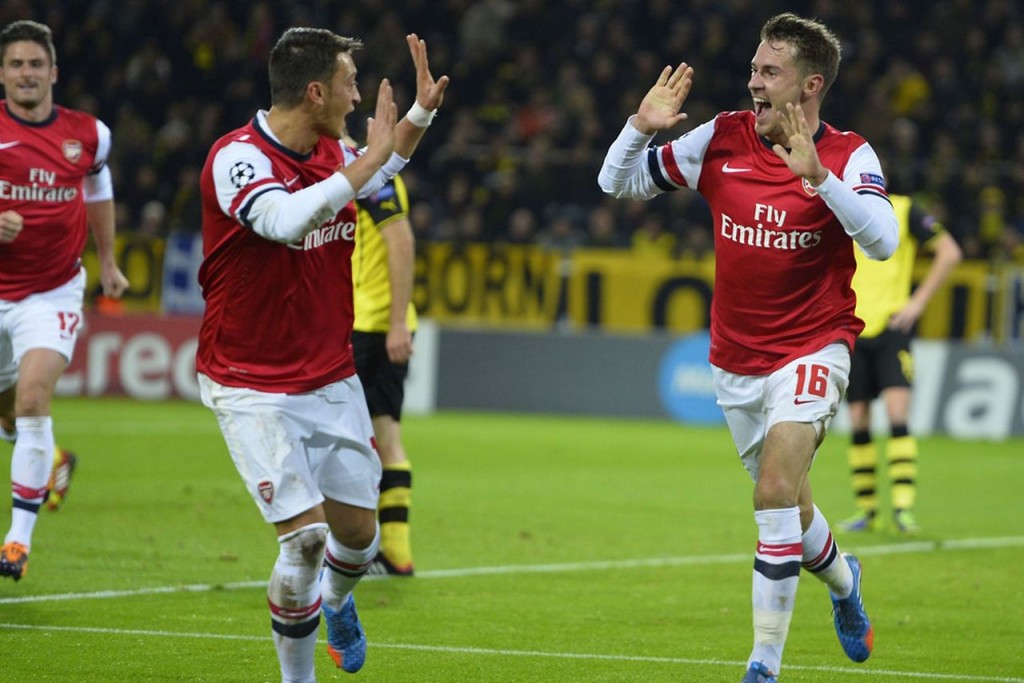 Aaron Ramsay and Mesut Özil celebrate a goal