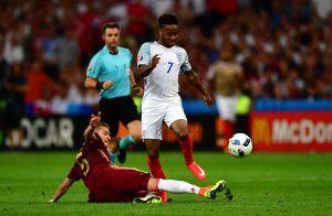 MARSEILLE, FRANCE - JUNE 11: Raheem Sterling of England is tackled by Roman Neustadter of Russia during the UEFA EURO 2016 Group B match between England and Russia at Stade Velodrome on June 11, 2016 in Marseille, France. (Photo by Dan Mullan/Getty Images)